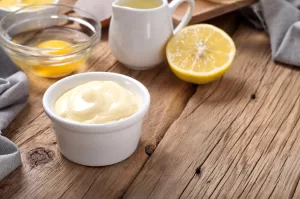 Fresh mayonnaise with ingredients for cooking homemade mayonnaise closeup