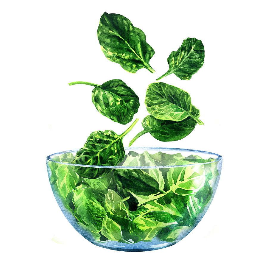Spinach falling into a bowl
